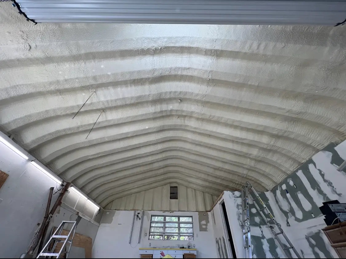 Spray polyurethane foam applied to the underside of a metal roof deck in Helena Valley West Central